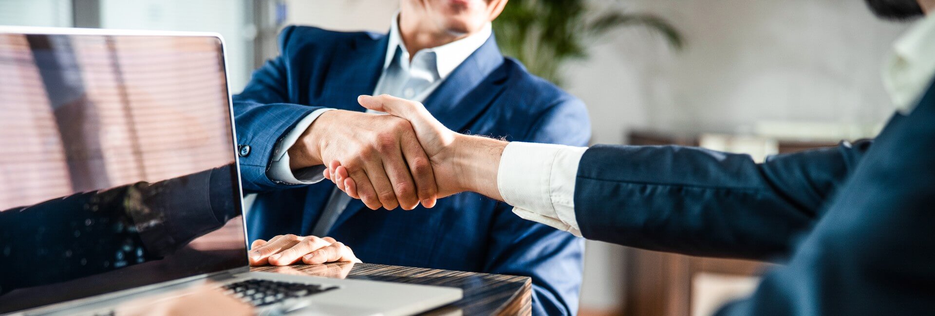 Business Insurance agents shaking hands